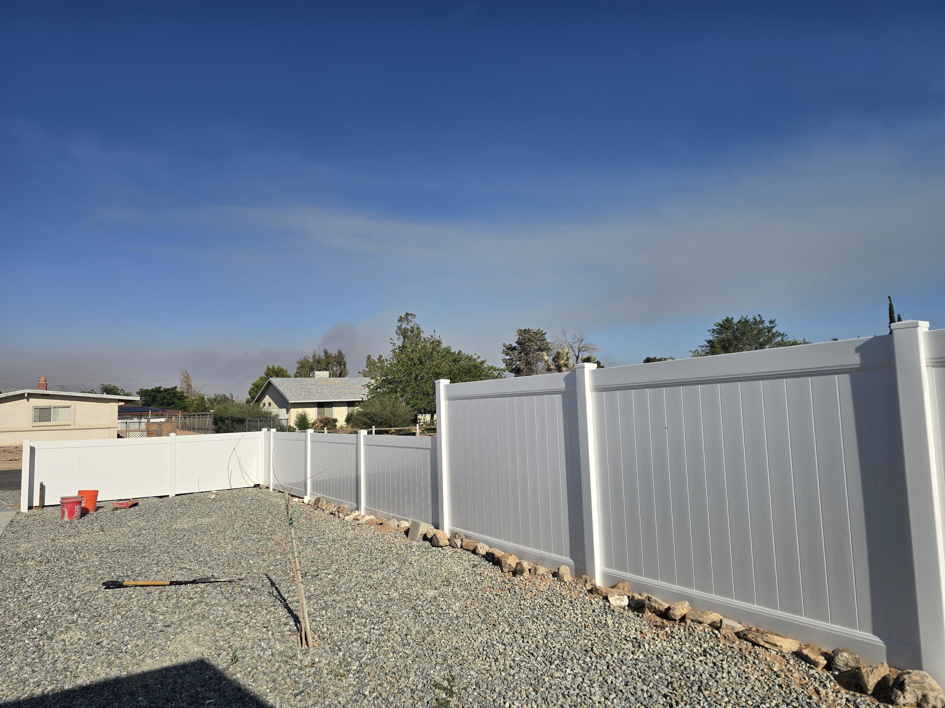Detail view of white vinyl privacy fence panels