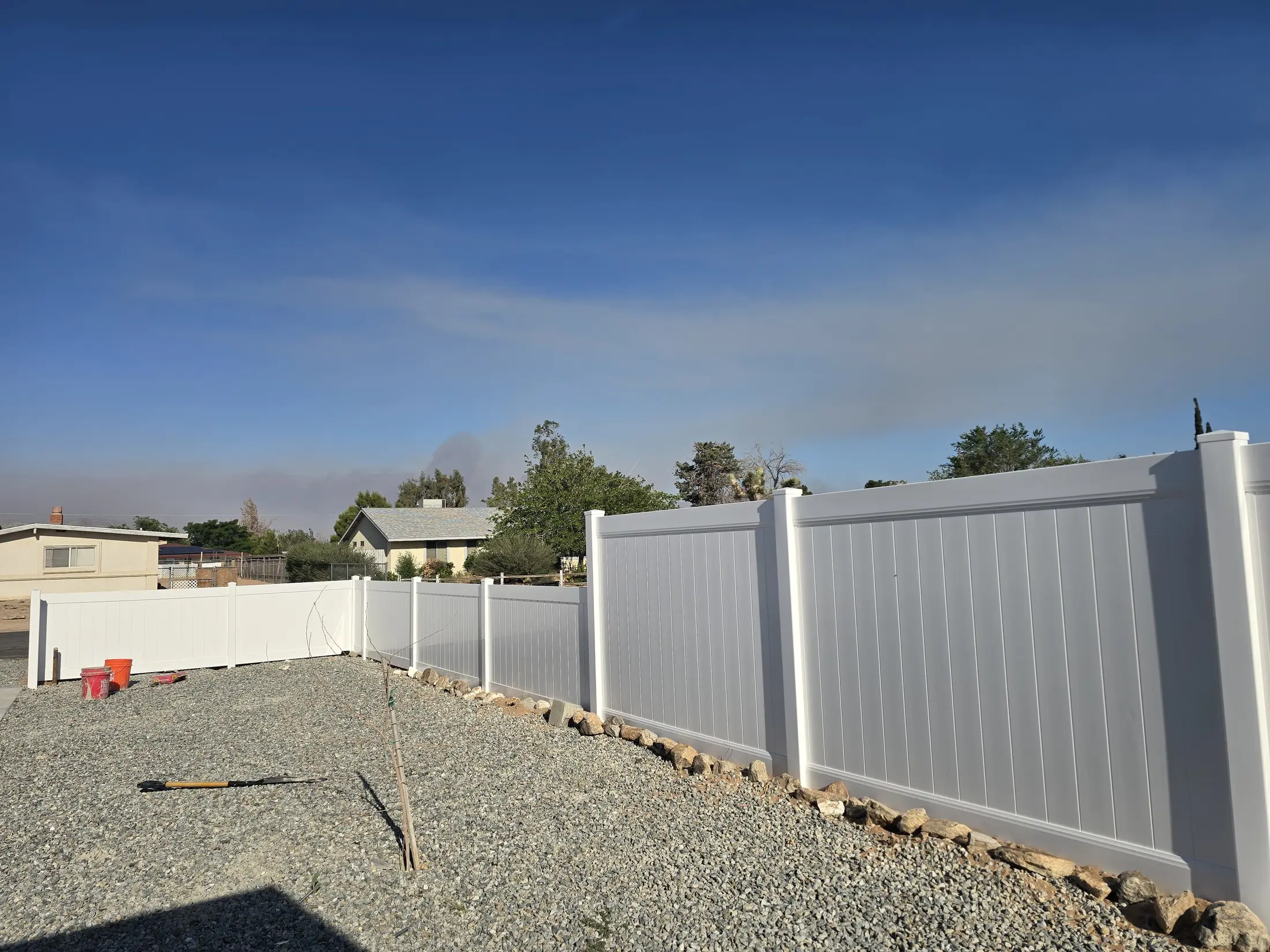 Detail view of white vinyl privacy fence panels