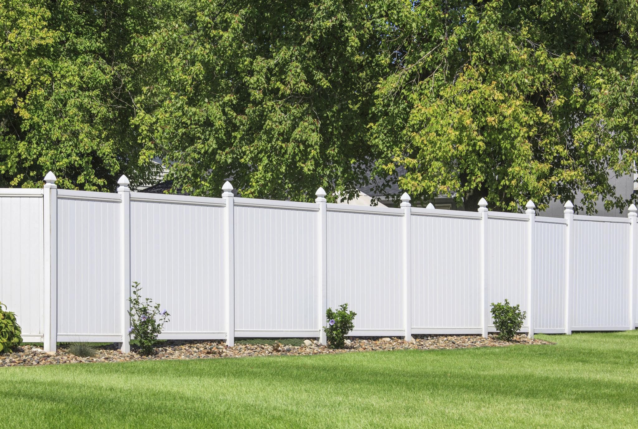 White vinyl privacy fence with full-height solid panels